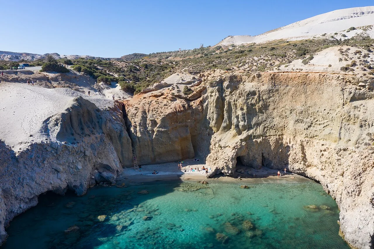 Tsigrado from above: a small sand cove between ochre cliffs